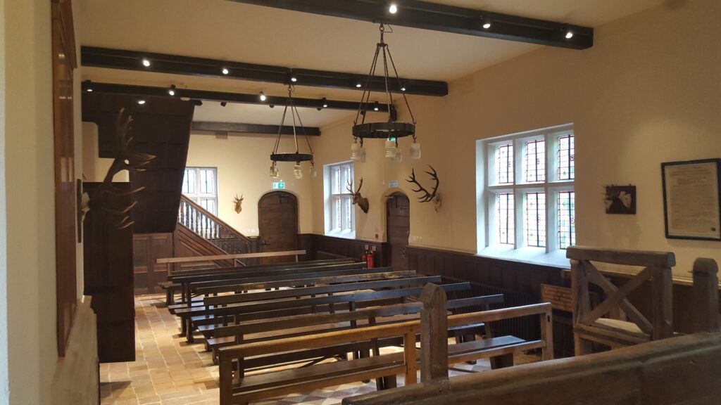 Wooden benches in a large hall